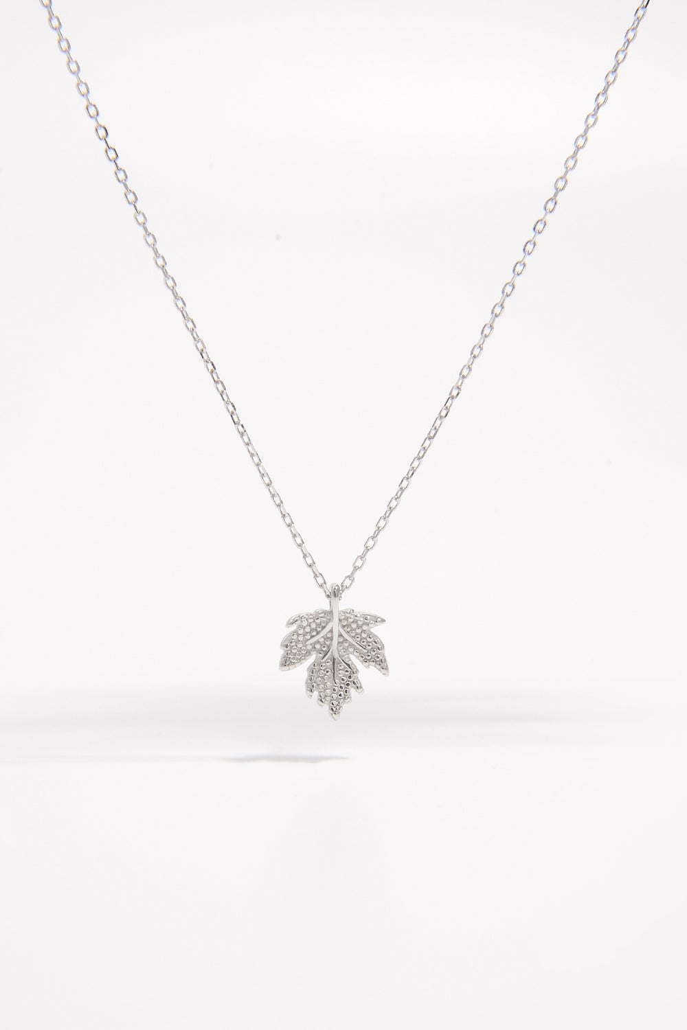 Sparkling Autumn Elegance: Zircon-Encrusted Silver Maple Pendant